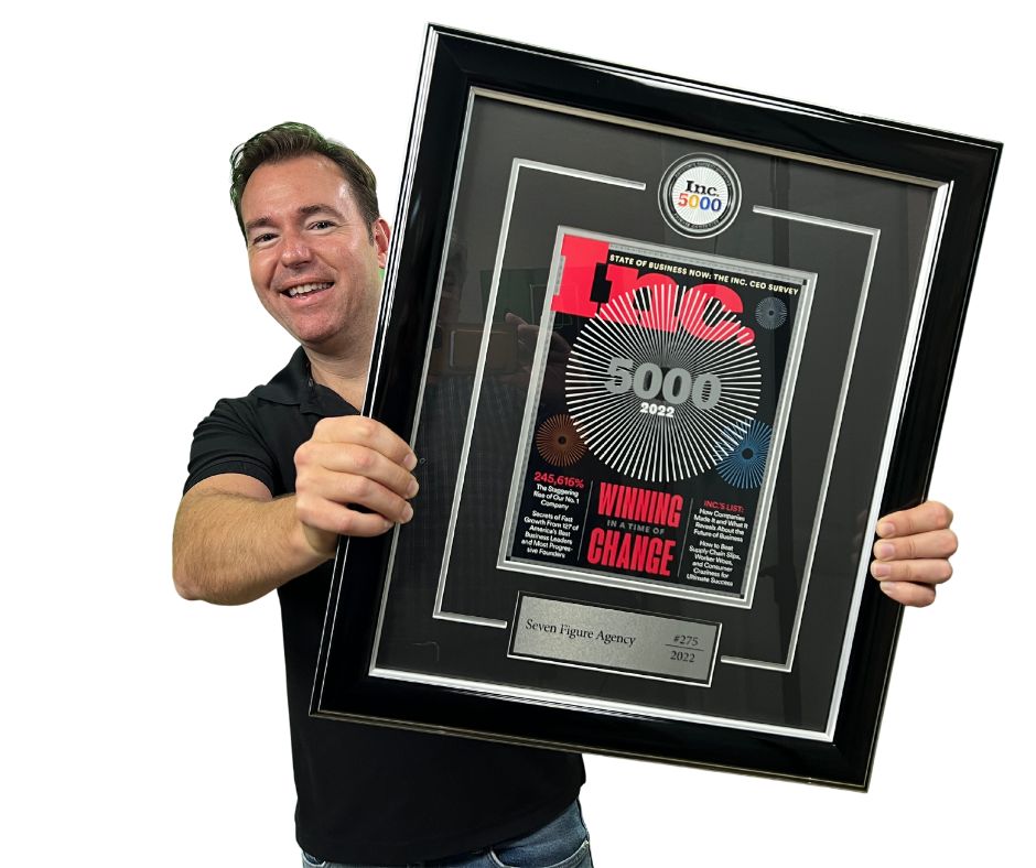 Josh Nelson holding Seven Figure Agency's framed Inc. 5000 honoree plaque (#275, 2022)
